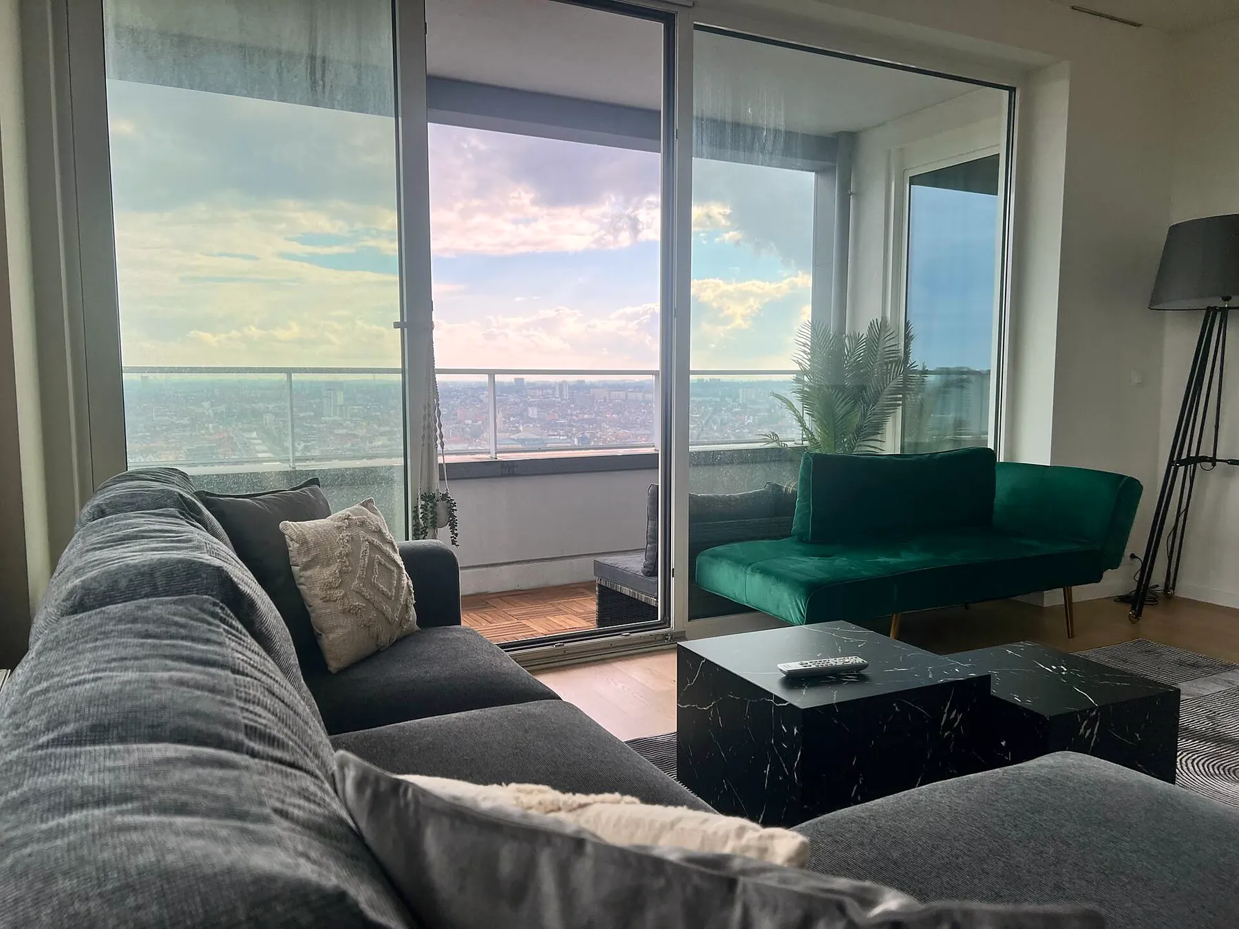 Corner sofa facing the glass façade