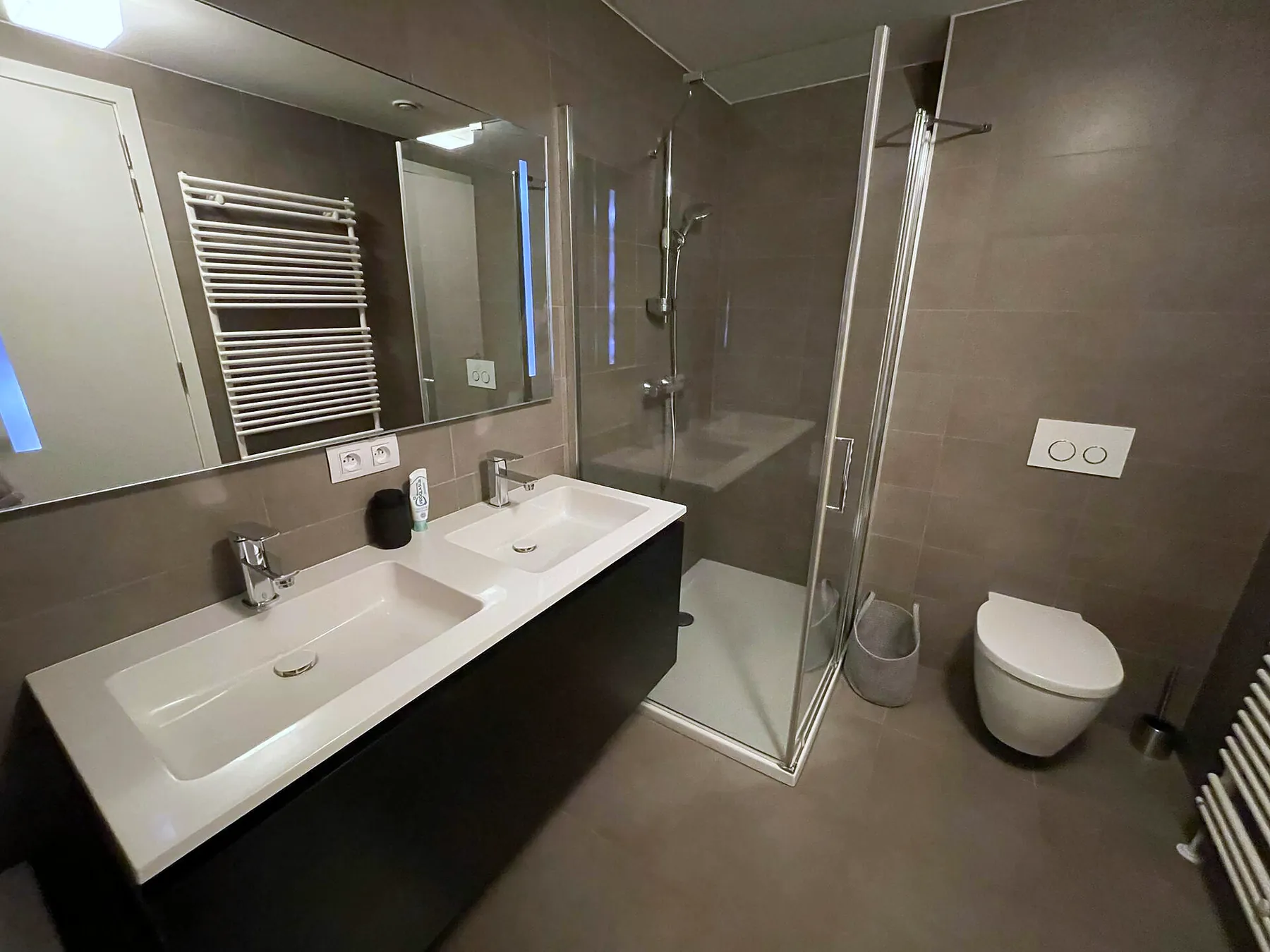 Bathroom with double basin and walk-in shower