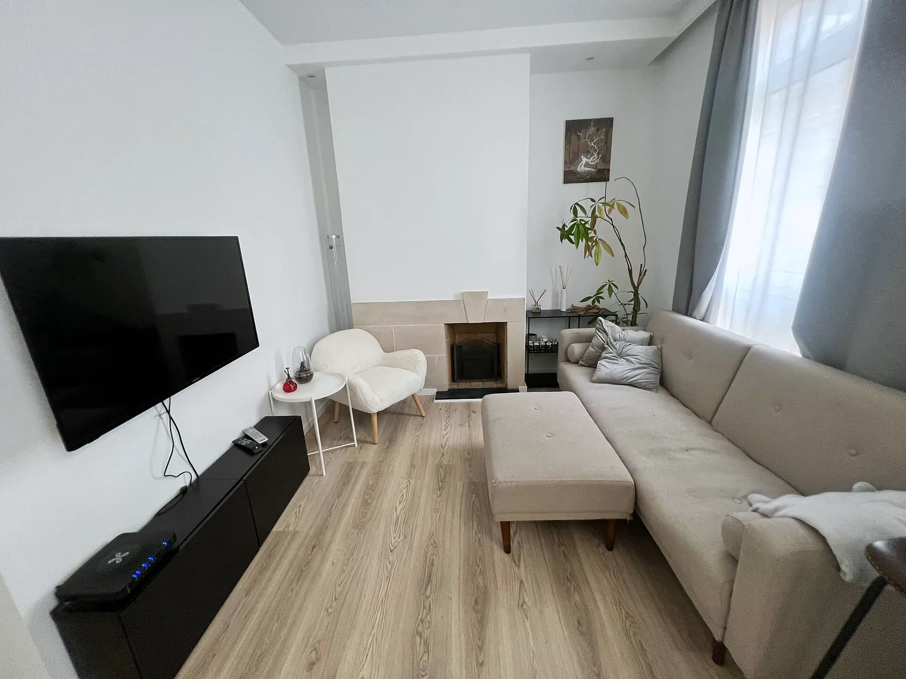 Living area with TV and corner sofa