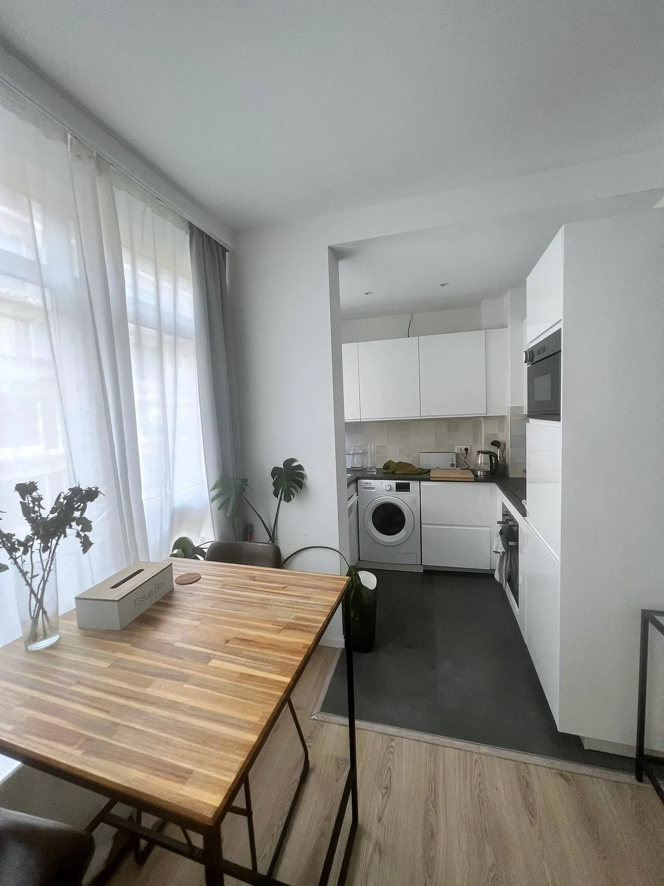 Dining table leading to the kitchen