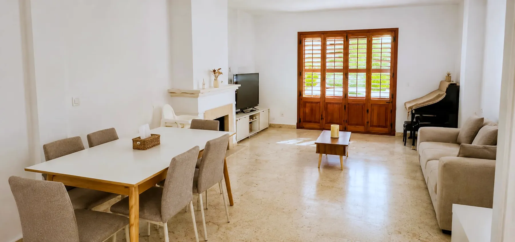 Open-plan dining and living room with fireplace