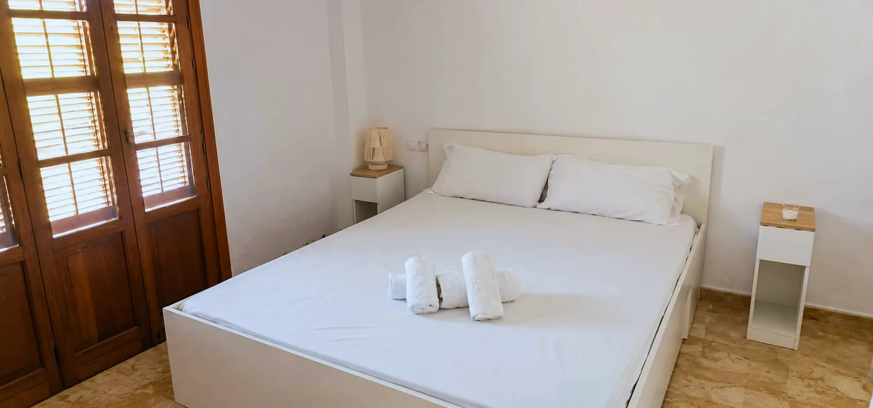 Double bedroom with wooden shutters